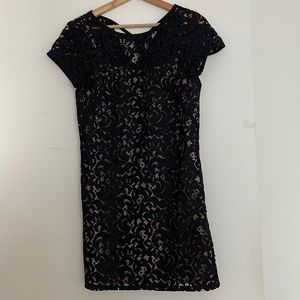 Black patterned mini dress with nude slip liner